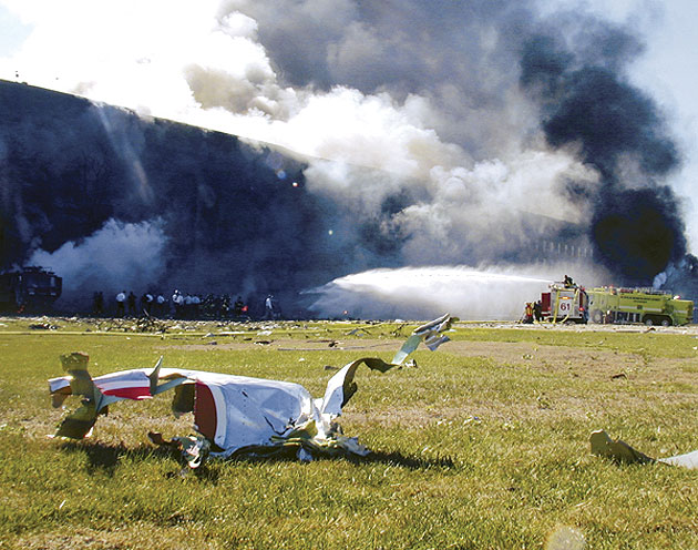 Flight 77 debris lies next to Pentagon on September 11, 2001